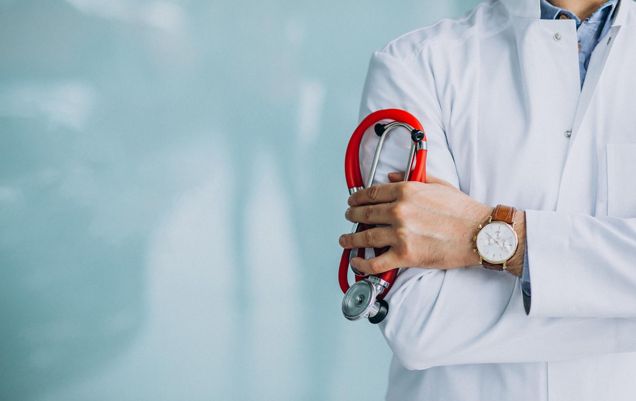 Clinician holding a stethoscope